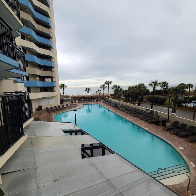 view of swimming pool with a patio