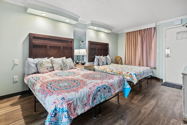 bedroom with ornamental molding, dark hardwood / wood-style floors, and a textured ceiling