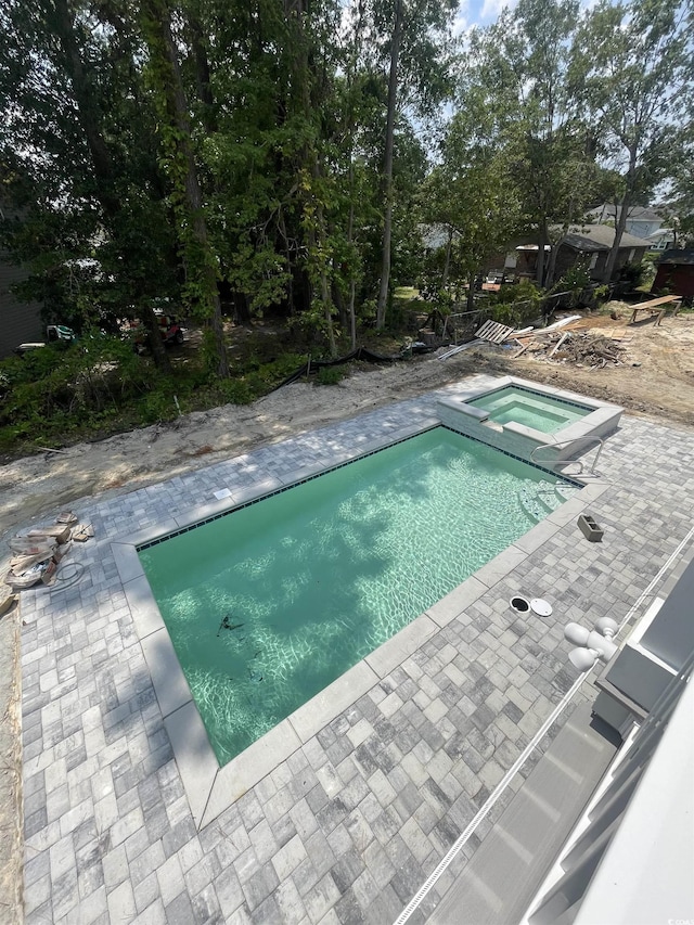 721 10th Ave S, Surfside Beach, SC 29575 - view of swimming pool with a patio area and a pool with connected hot tub