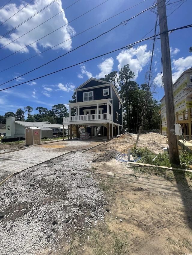 721 10th Ave S, Surfside Beach, SC 29575 - beach home featuring a carport and gravel driveway