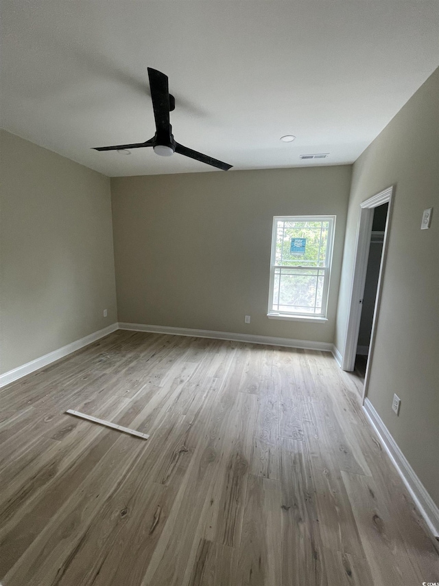721 10th Ave S, Surfside Beach, SC 29575 - empty room with ceiling fan and wood finished floors