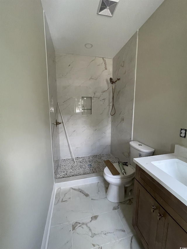 721 10th Ave S, Surfside Beach, SC 29575 - bathroom featuring a marble finish shower, vanity, and marble finish flooring