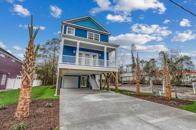 beach home with a garage and a porch