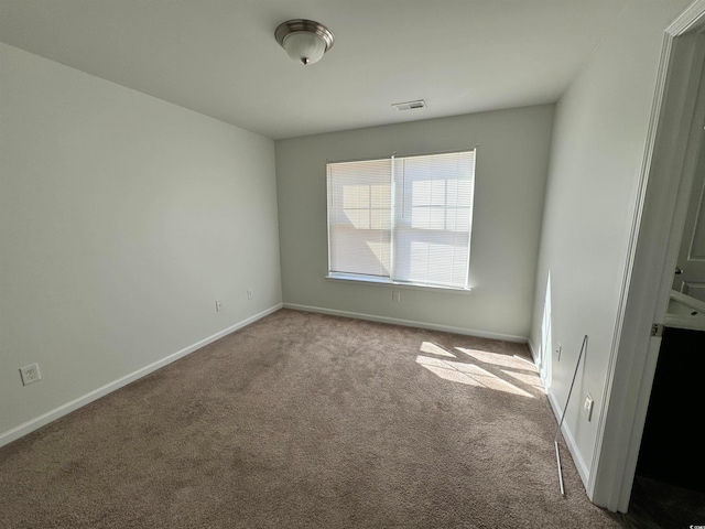 empty room with light colored carpet