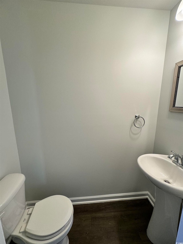 bathroom featuring toilet and hardwood / wood-style floors