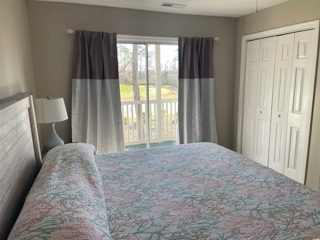 bedroom featuring a closet and access to exterior