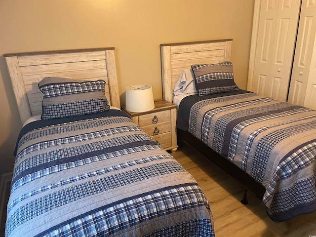 bedroom featuring a closet and light hardwood / wood-style flooring