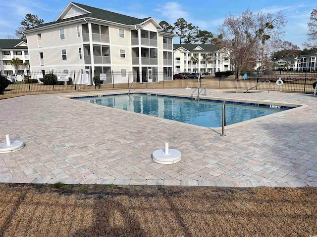 view of swimming pool with a patio