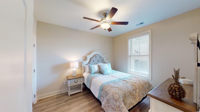 35 Delray Dr Unit 1-D, Murrells Inlet, SC 29576 - bedroom with ceiling fan, baseboards, visible vents, and light wood-type flooring