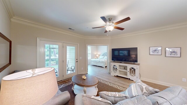 35 Delray Dr Unit 1-D, Murrells Inlet, SC 29576 - living area with wood finished floors, visible vents, crown molding, and baseboards