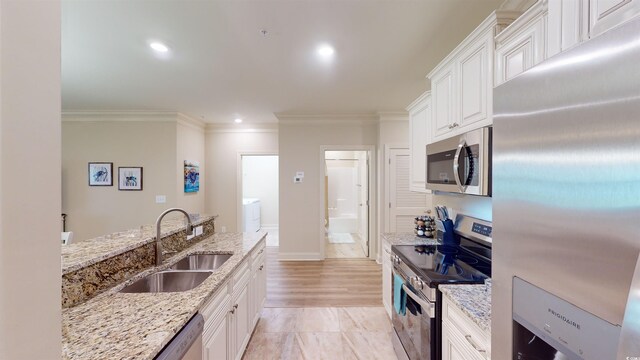 35 Delray Dr Unit 1-D, Murrells Inlet, SC 29576 - kitchen featuring crown molding, appliances with stainless steel finishes, a sink, and white cabinetry
