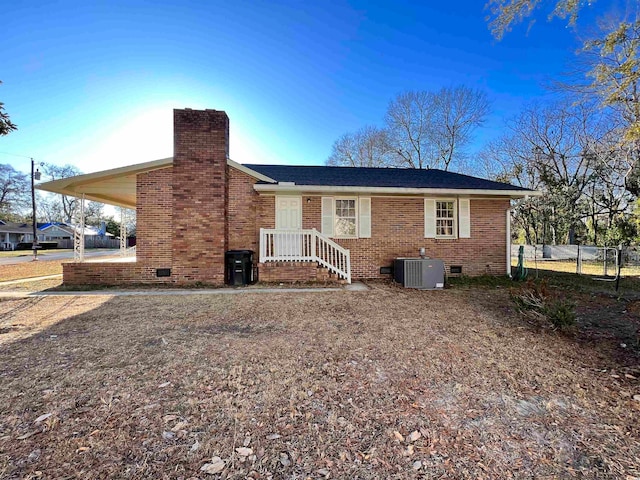 rear view of property with central air condition unit