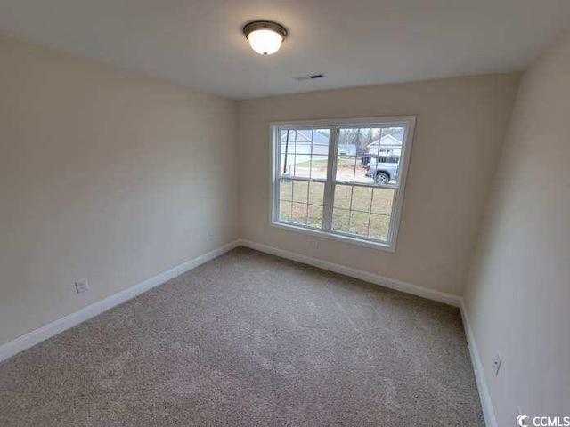 unfurnished room featuring carpet flooring