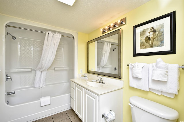 full bathroom featuring toilet, shower / tub combo, tile floors, a textured ceiling, and vanity