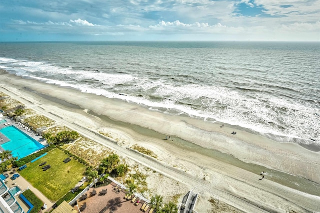 bird's eye view featuring a water view and a view of the beach