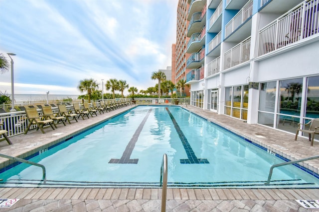 view of swimming pool with a patio