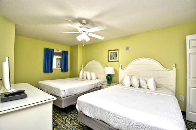 bedroom featuring a textured ceiling and ceiling fan