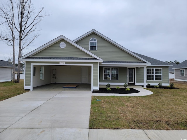 view of front of property with a front lawn and a carport