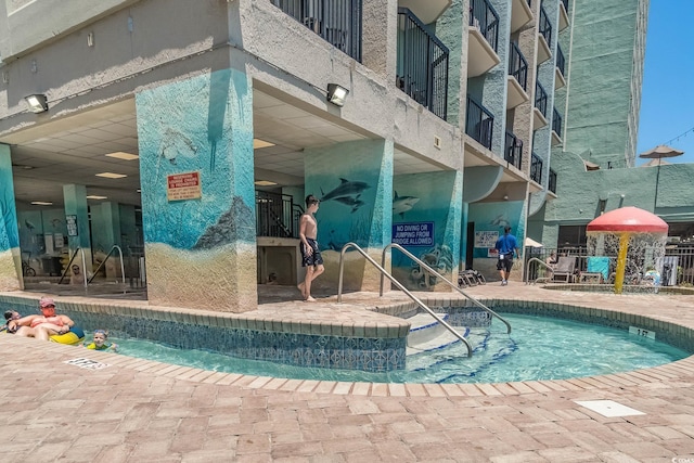 view of swimming pool with a patio