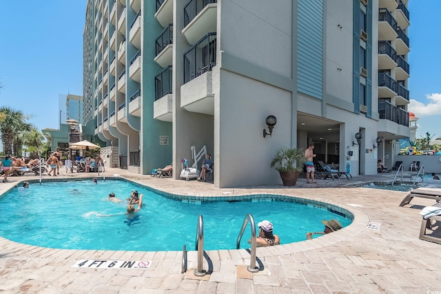 view of pool featuring a patio