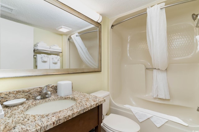 full bathroom featuring toilet, a textured ceiling, shower / bathtub combination with curtain, and vanity