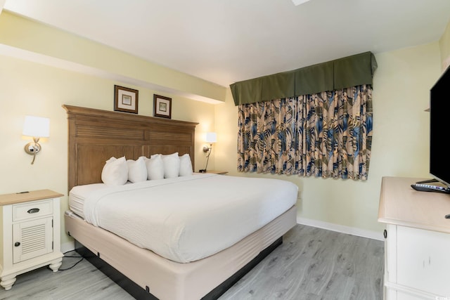 bedroom with light wood-type flooring