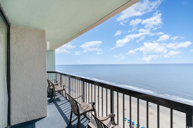 balcony featuring a water view