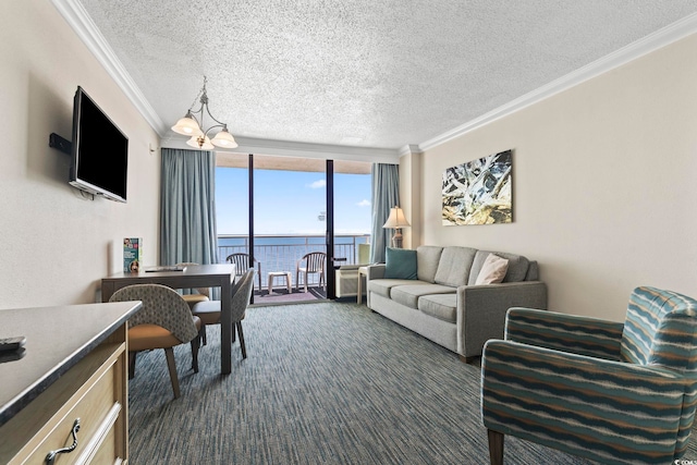 carpeted living room with a notable chandelier, a textured ceiling, crown molding, and a water view