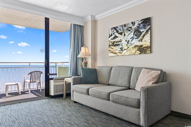 living room featuring a textured ceiling, a wall of windows, ornamental molding, a water view, and dark colored carpet