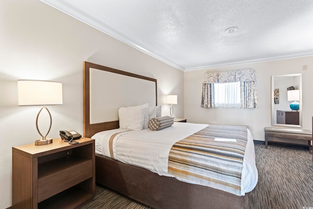 bedroom with a textured ceiling and ornamental molding