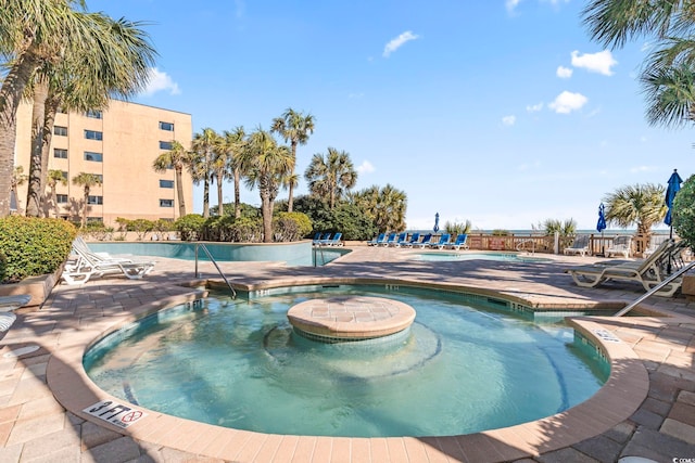 view of swimming pool with a patio