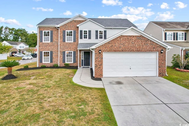 view of front of house with a garage and a front yard