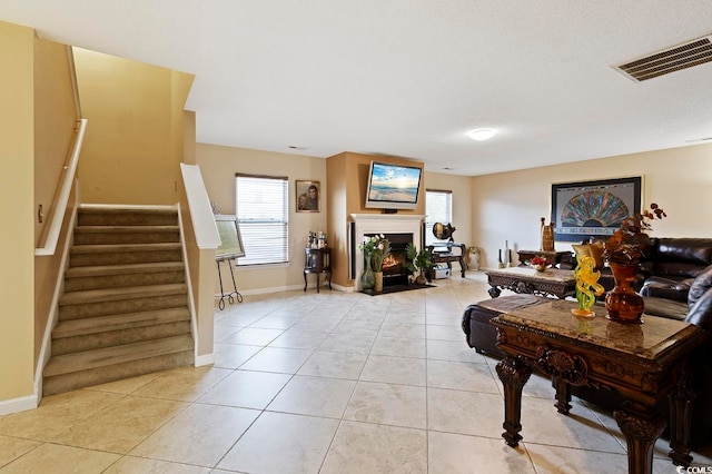 living room featuring light tile floors