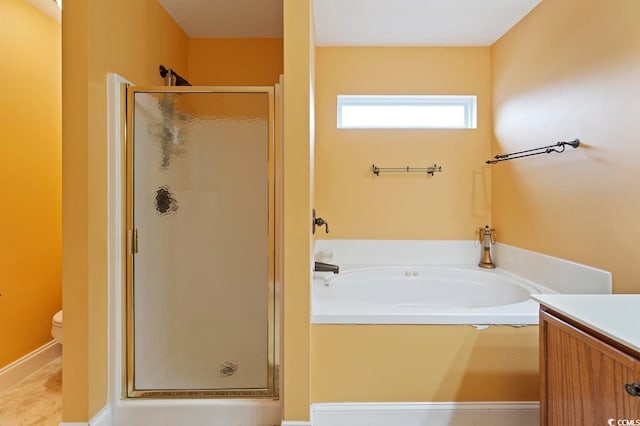 full bathroom with a textured ceiling, shower with separate bathtub, tile floors, toilet, and vanity