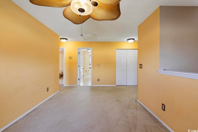 carpeted spare room with a textured ceiling