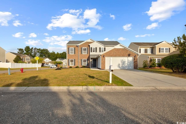 view of front of property with a garage and a front yard