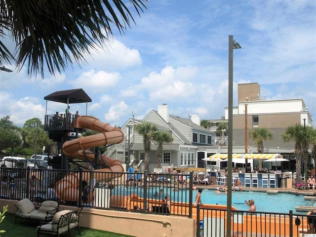 view of swimming pool featuring a water slide