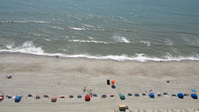 exterior space with a water view and a view of the beach