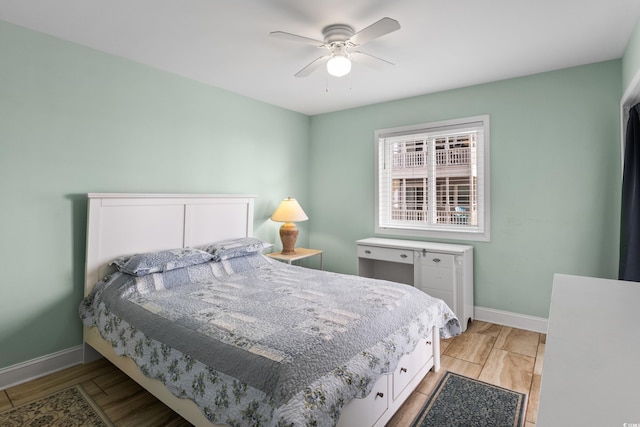 bedroom featuring ceiling fan and light hardwood / wood-style floors