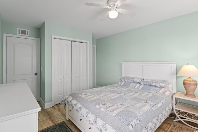 bedroom featuring ceiling fan, a closet, and light wood-type flooring