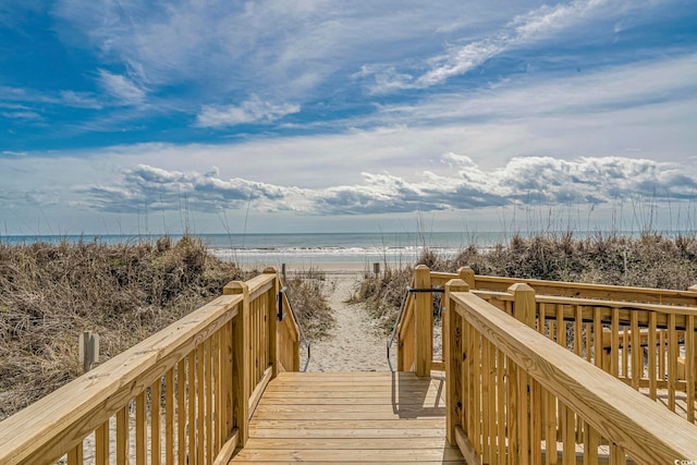 view of nearby features featuring a beach view and a water view