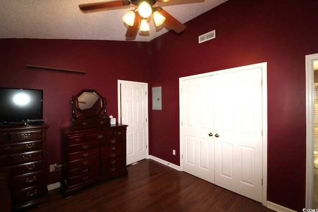 bedroom with ceiling fan, lofted ceiling, and dark hardwood / wood-style flooring