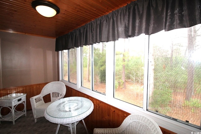 sunroom featuring wood ceiling