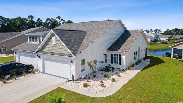 view of front facade featuring a garage and a front lawn