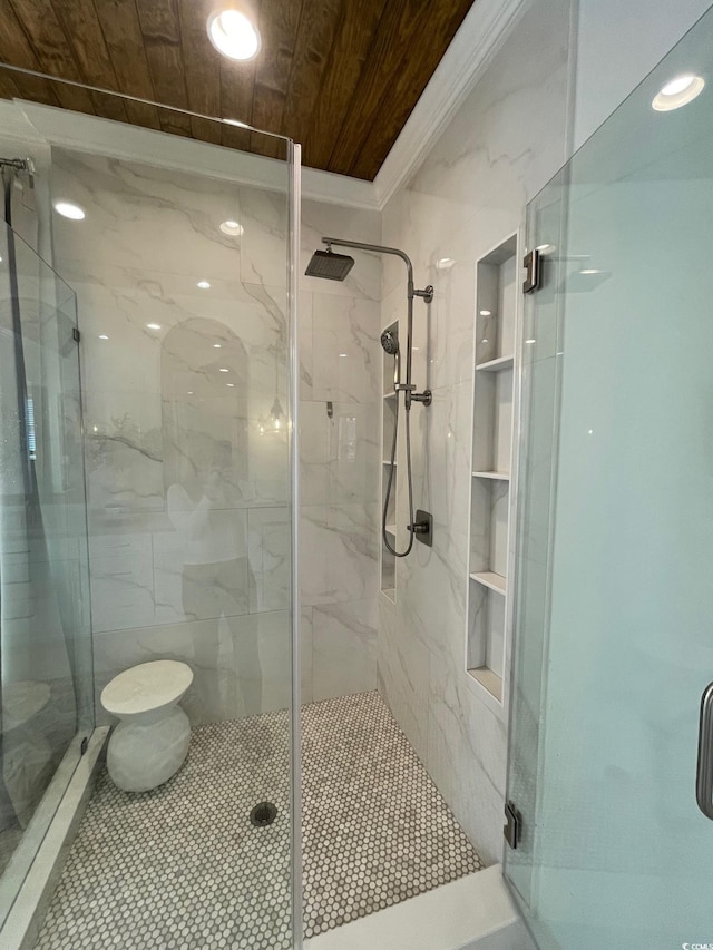 bathroom with wood ceiling and a shower with door