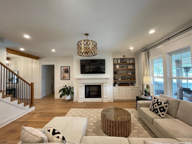 living room with a chandelier and wood-type flooring