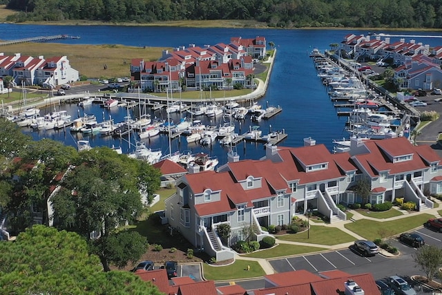 birds eye view of property with a water view