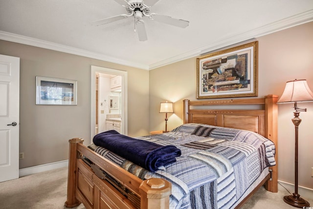 bedroom featuring light carpet, ensuite bath, ceiling fan, and ornamental molding