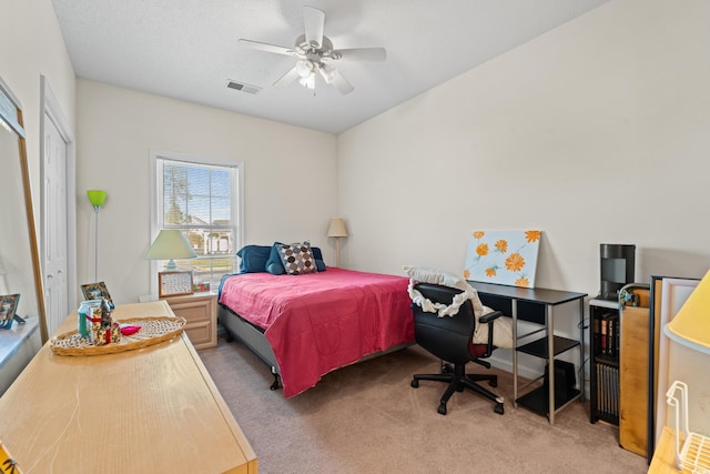 carpeted bedroom with a closet and ceiling fan