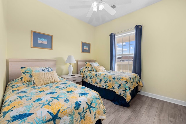 bedroom with hardwood / wood-style flooring and ceiling fan